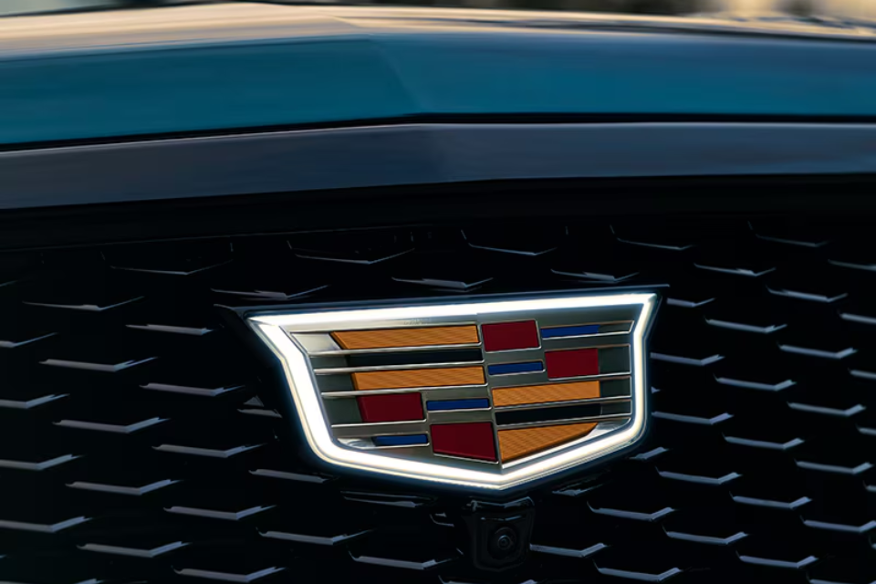 Illuminated Cadillac crest integrated into the distinctive front grille of the 2026 Escalade